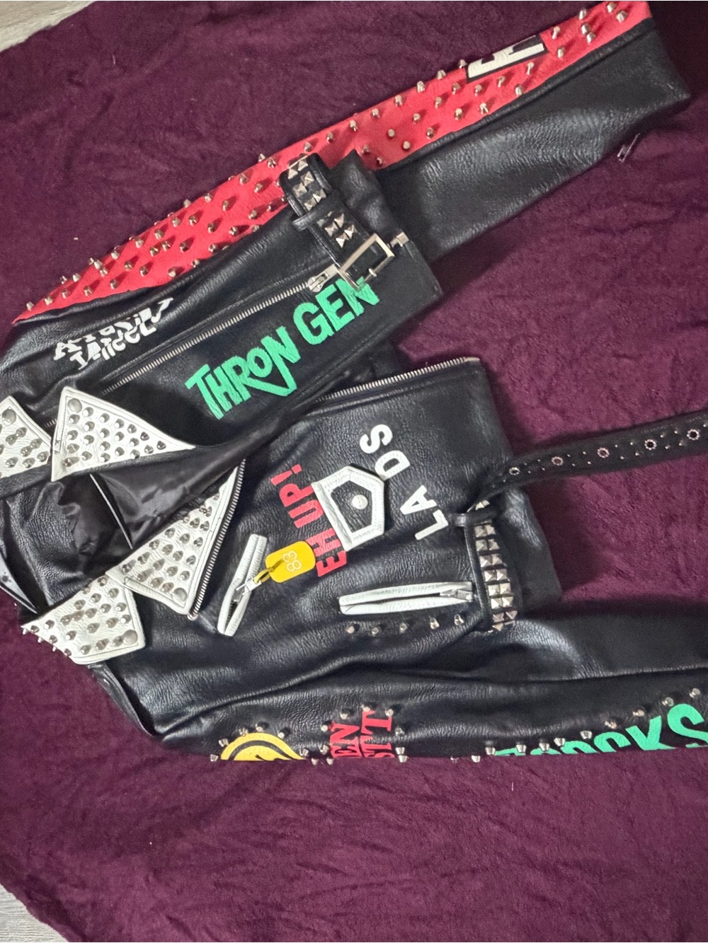 Black Studded Leather Biker Jacket with Graphic Accents